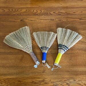 Creative Co-Op Natural Straw Hand Brooms with Brown, Blue, and Yellow Handles